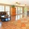 a large living room with a large rug and a table