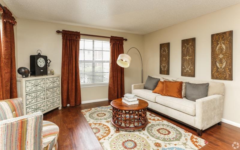 a living room with a couch and a table